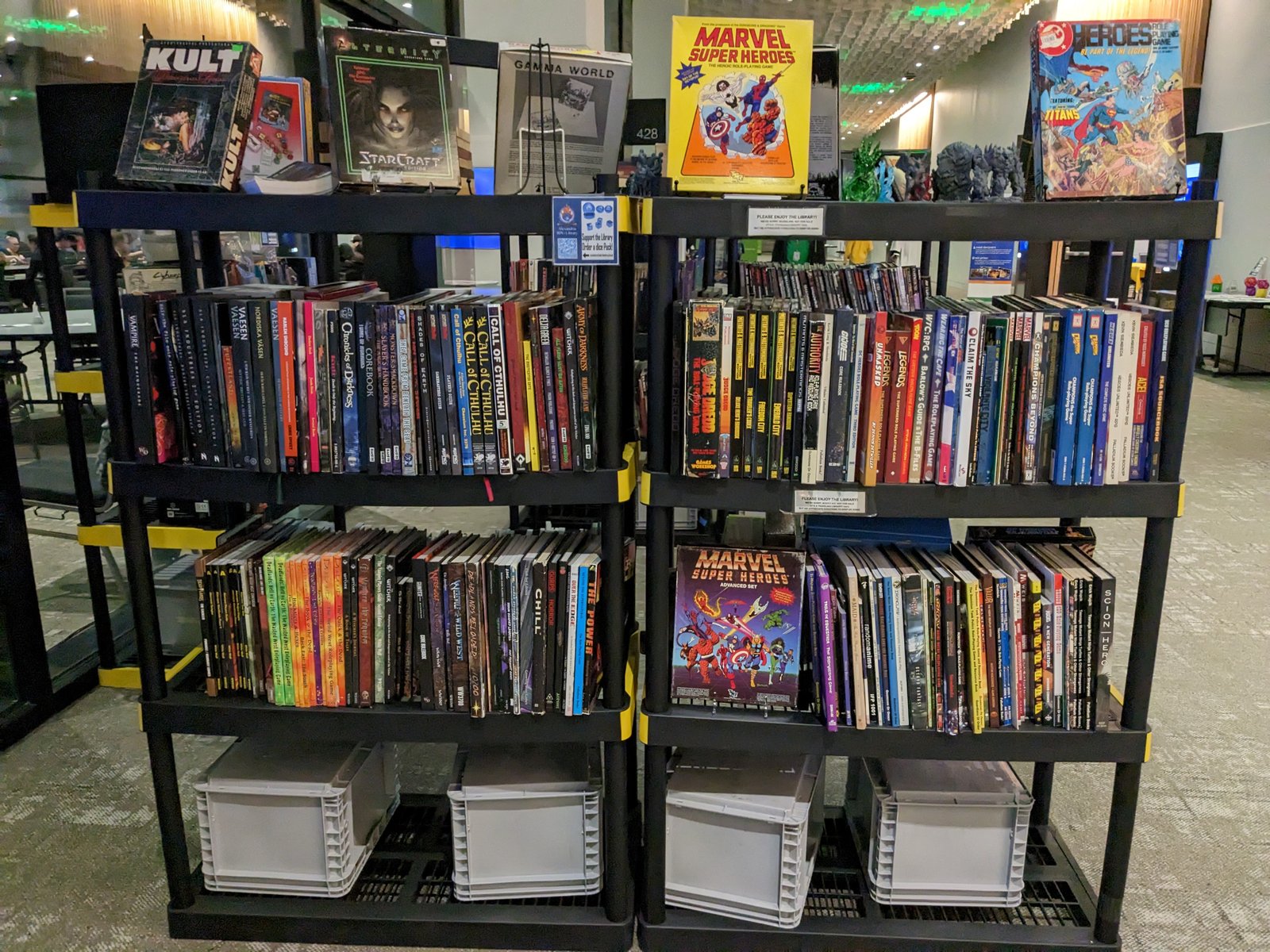 Shelves of comics, tabletop games, and Marvel collectibles