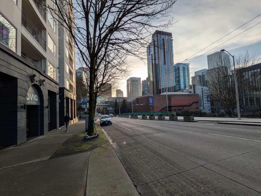 Pike Street looking toward downtown. Avia Apartments on the left, the Summit on the right, the Arch straight ahead. March 24, 2026.