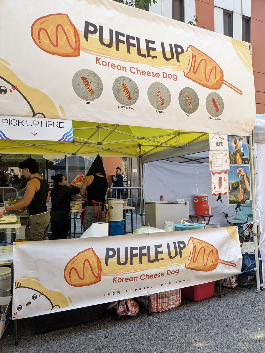 The Puffle Up cheese-dog stand on a car-free 9th Avenue at PAX 2023.